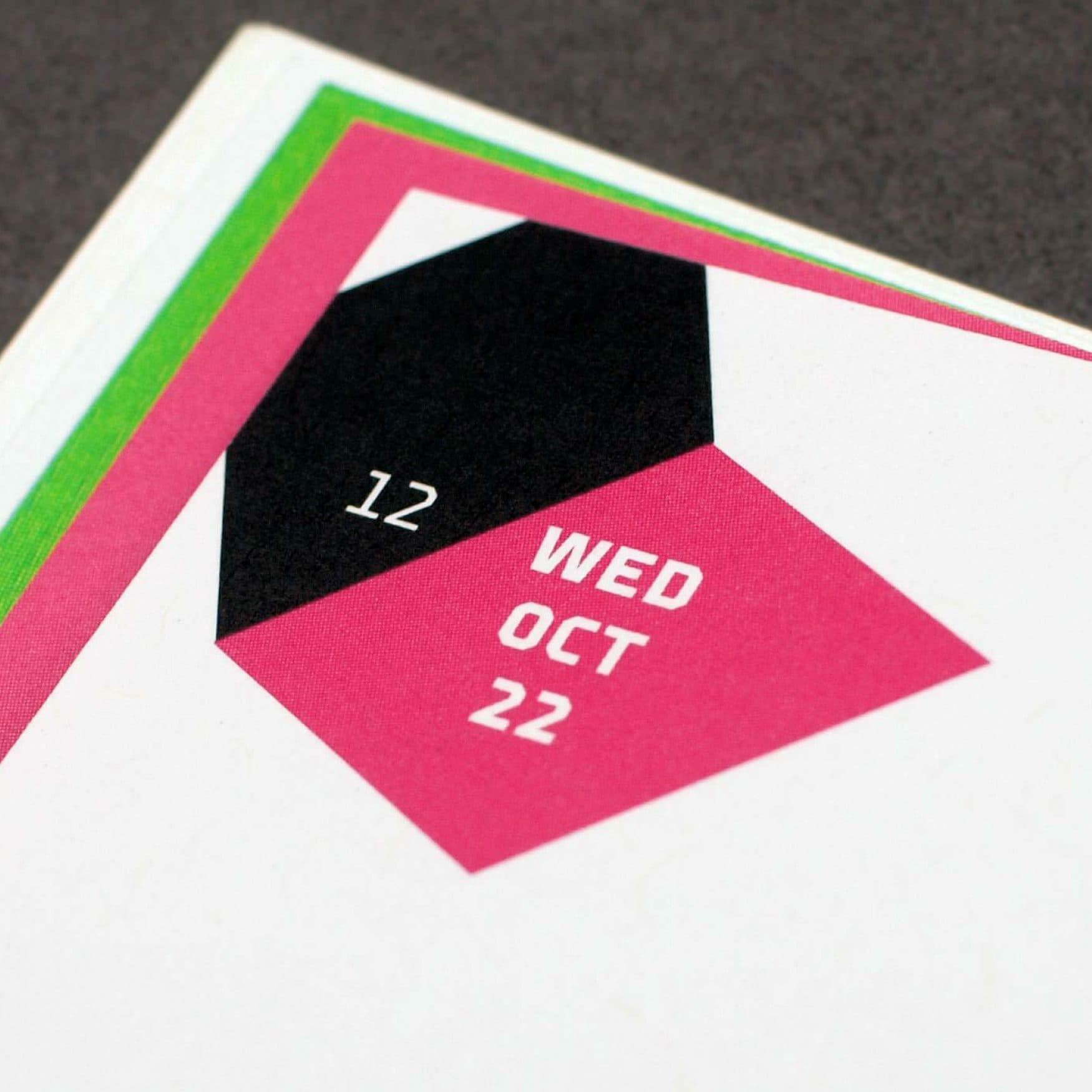 A geometric design forms a calendar page displaying "WED OCT 22" in white text on a pink background. Each date is set within overlapping shapes, with a black pentagon reading "12" on the left, all layered on a gray background with a green-bordered edge.