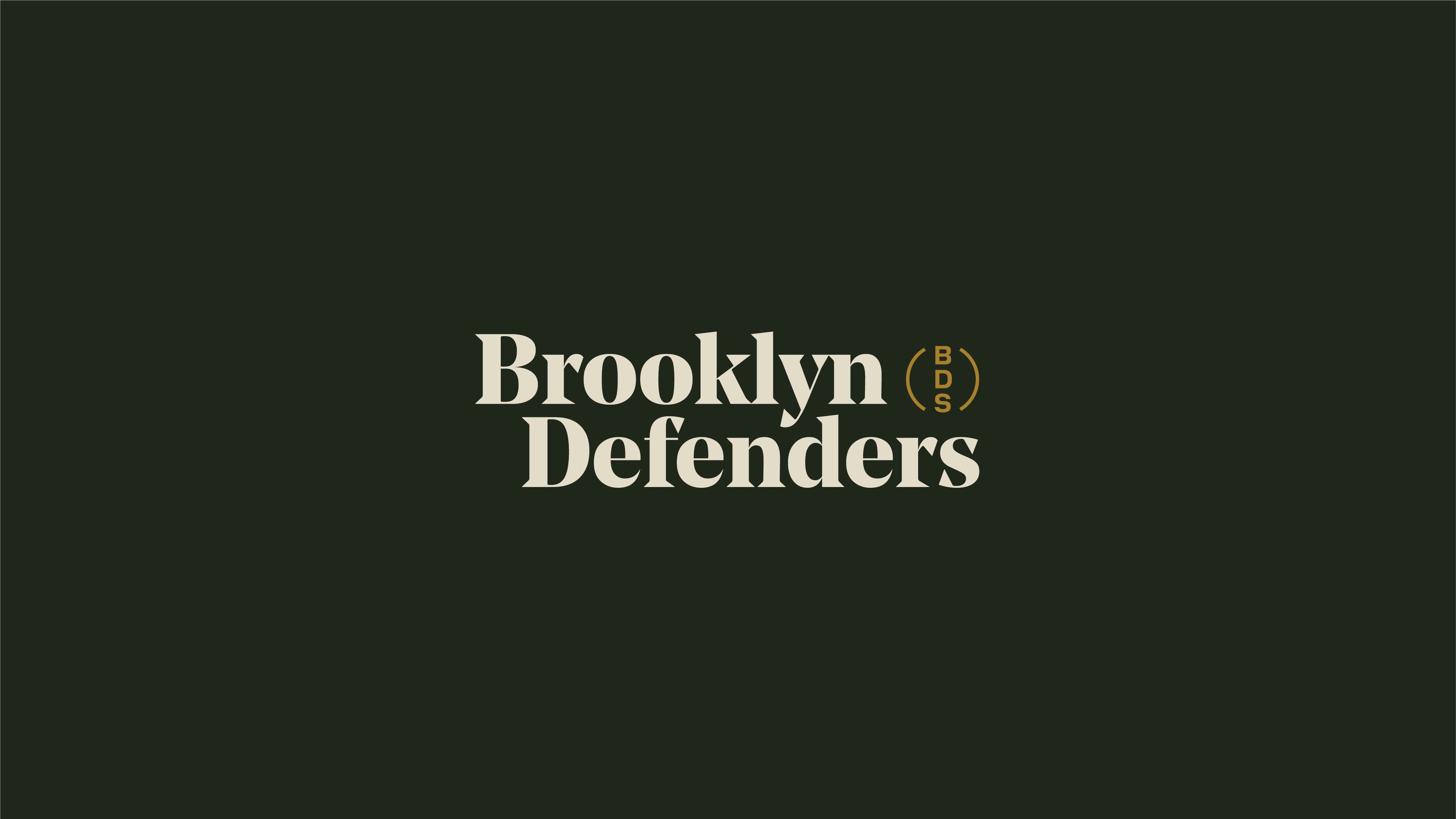 The image features the text "Brooklyn Defenders" in large, bold, off-white font centered against a dark green background. To the right of the text, there is a yellow circular emblem containing the letters "BDS.