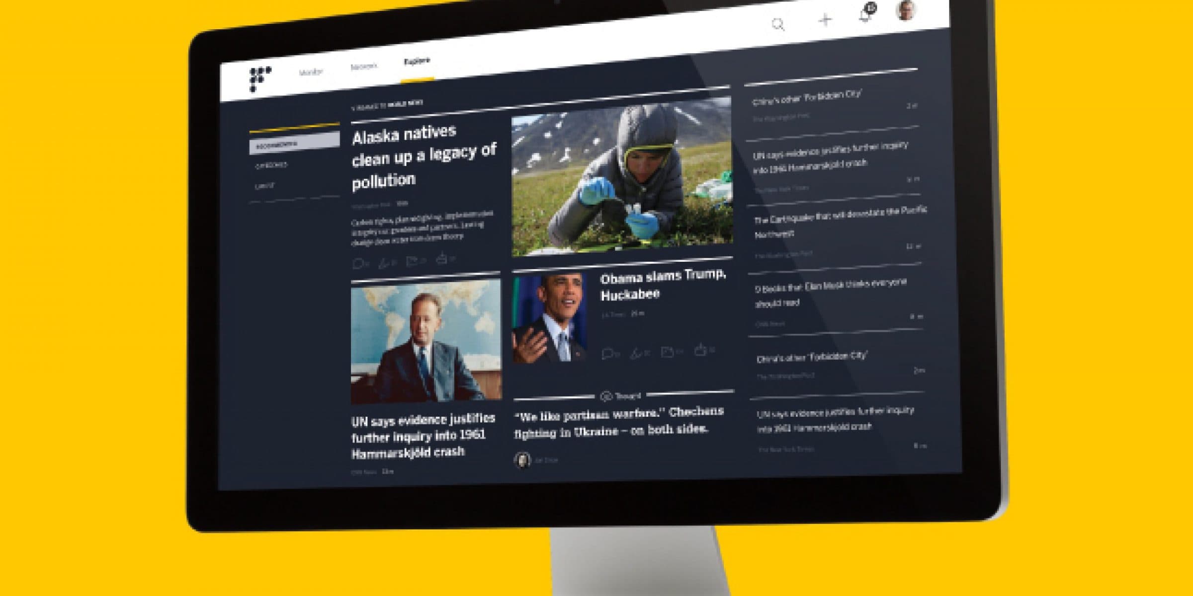 A computer monitor displaying a news website with a yellow background. The website shows various news articles with thumbnails, headlines, and brief descriptions. The leading article is about Alaska natives cleaning up pollution. Other articles feature political and global news.