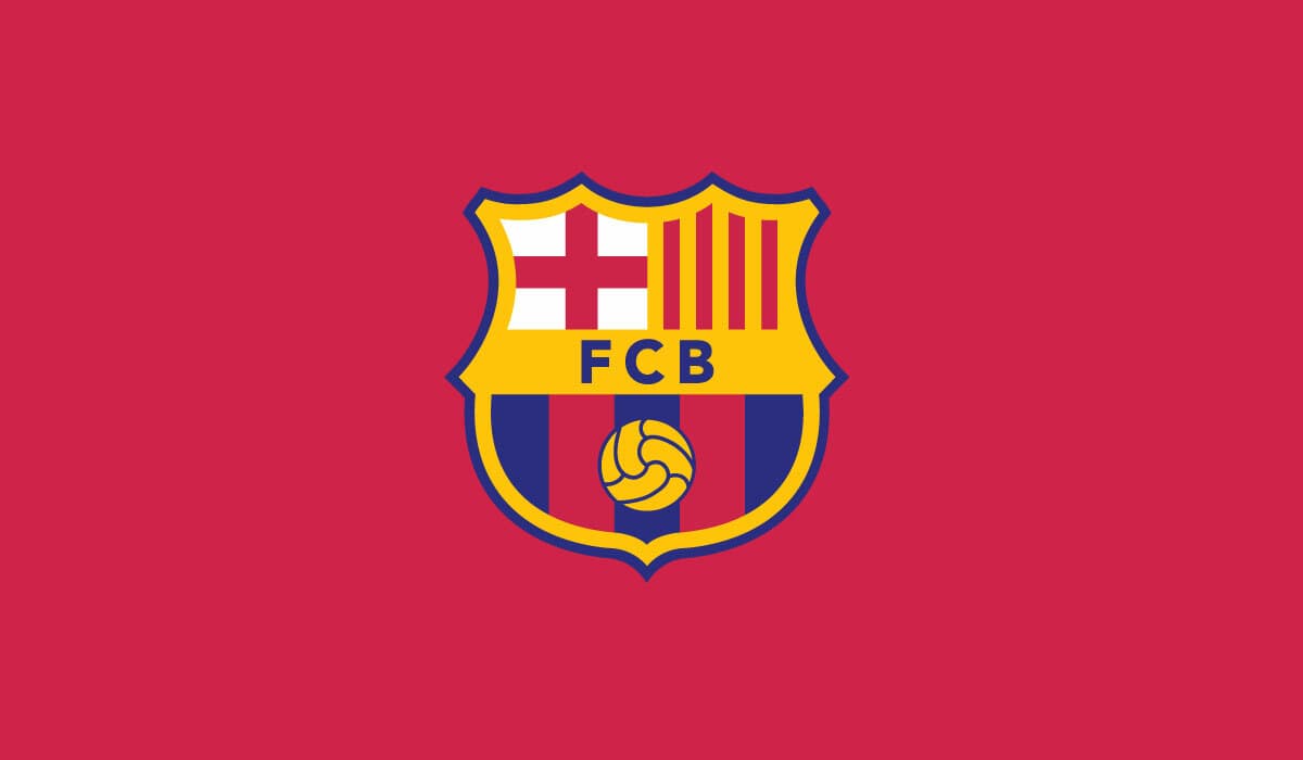 The image shows the logo of FC Barcelona, featuring a shield divided into four sections: the St George's Cross, the Catalan flag, the club’s initials “FCB,” and blue and red vertical stripes with a football at the bottom. The background is red.