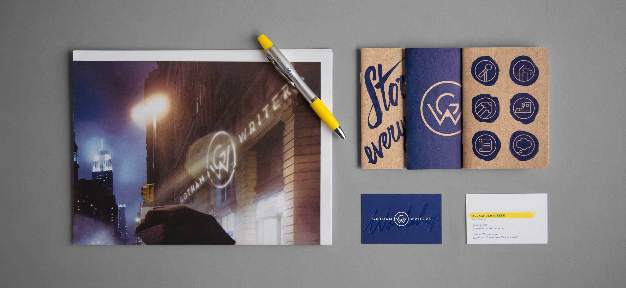 A flat lay of branded office supplies featuring the logo "GW". Items include a notepad with a pen, a flyer placed beneath the pen, a blue brochure with the phrase "Start every...", a dark blue business card, and a white business card with yellow accents.