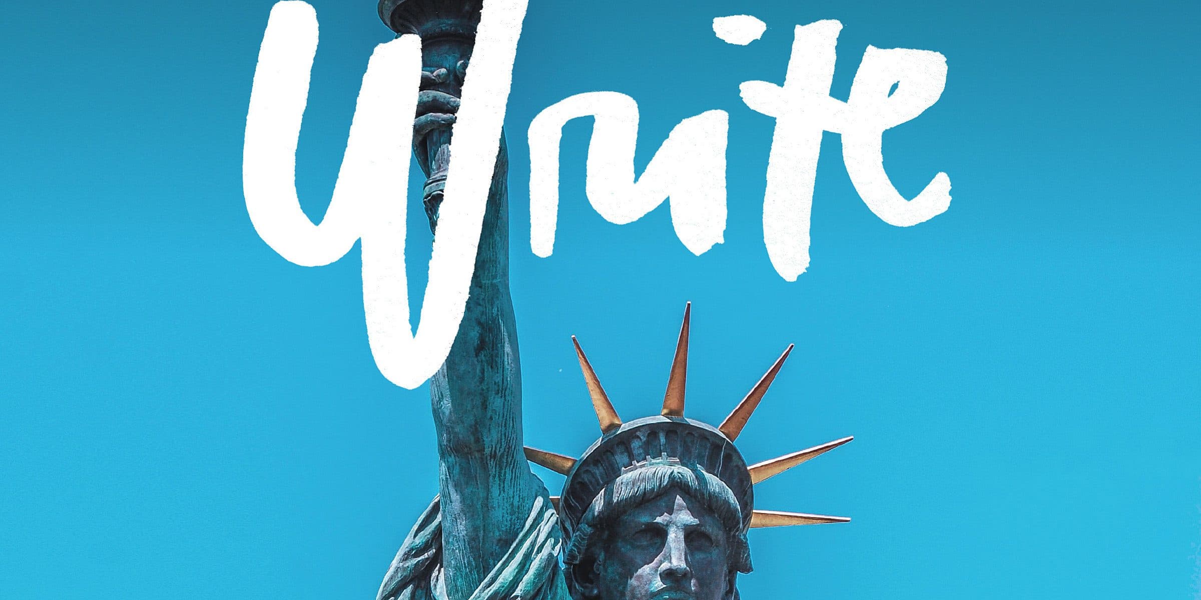 The Statue of Liberty holding a torch stands against a clear blue sky, with the word "Write" in bold white paint-like script overlaid on the image.