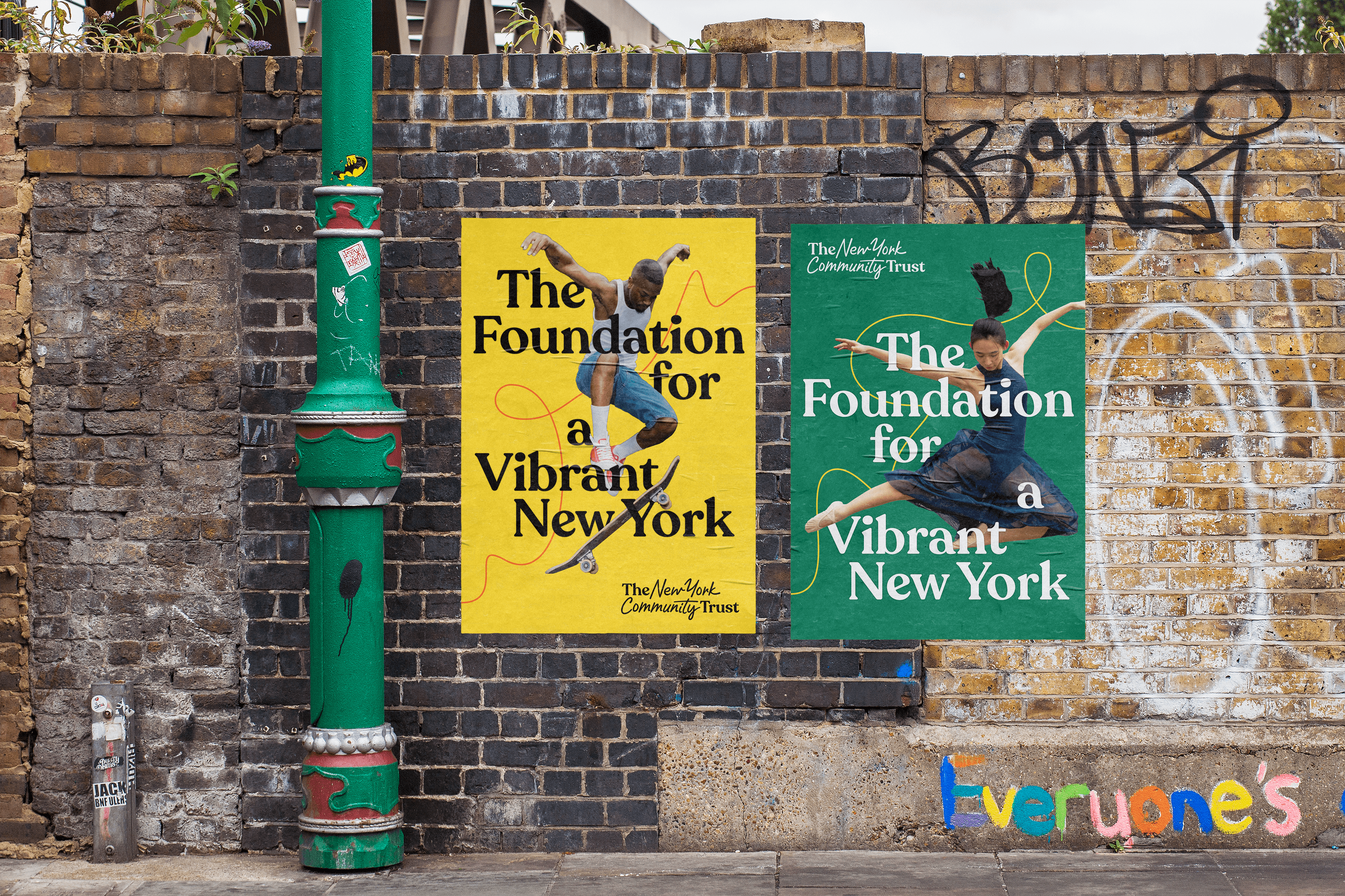 New York Community trust posters mocked up on a graffiti filled brick wall.