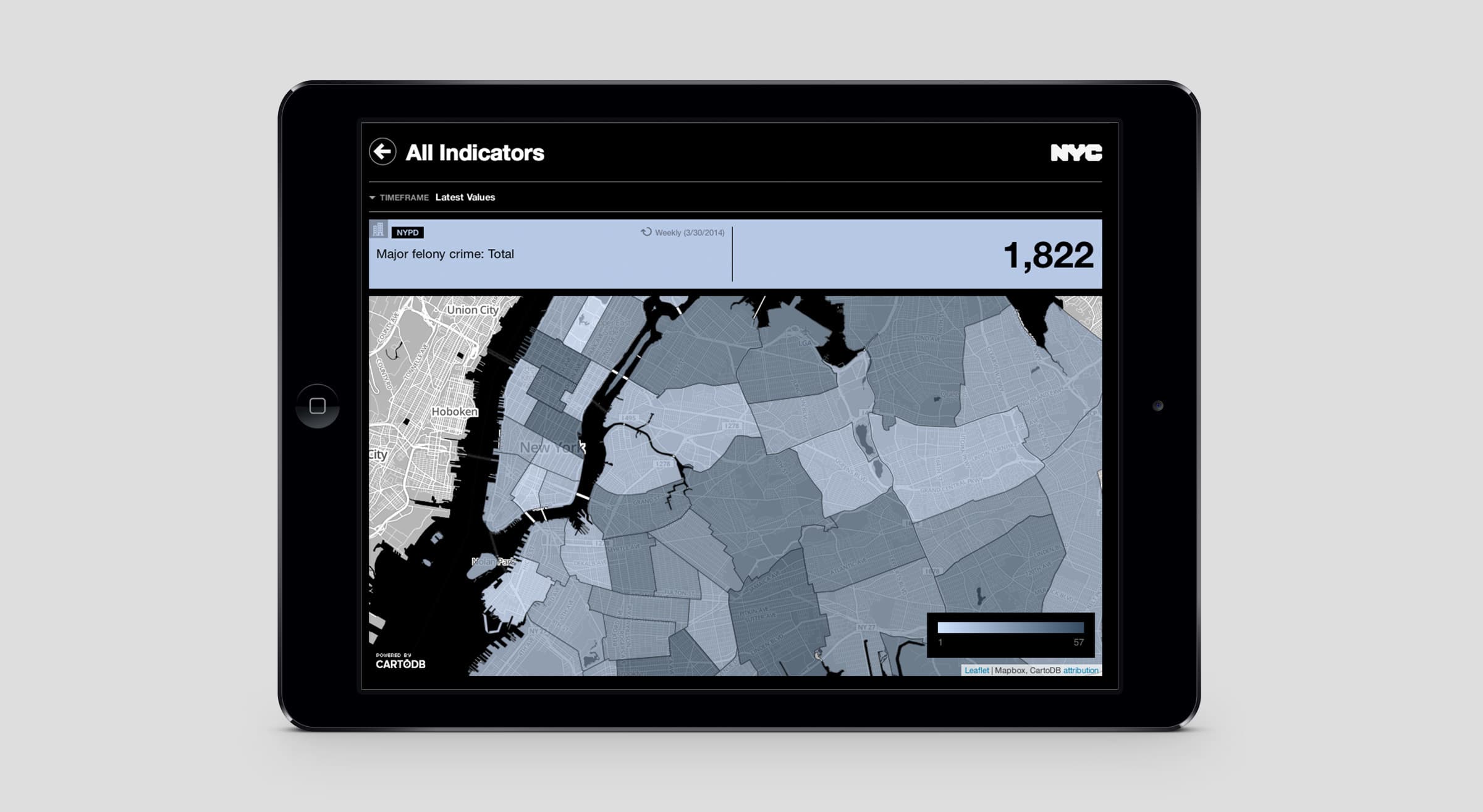 A tablet displays a map of New York City with shaded areas representing different data indicators. The screen shows a total value of 1,822 for major felonies. The map includes boroughs and districts, with a sidebar labeled "All Indicators" and "NYC" logo at the top.