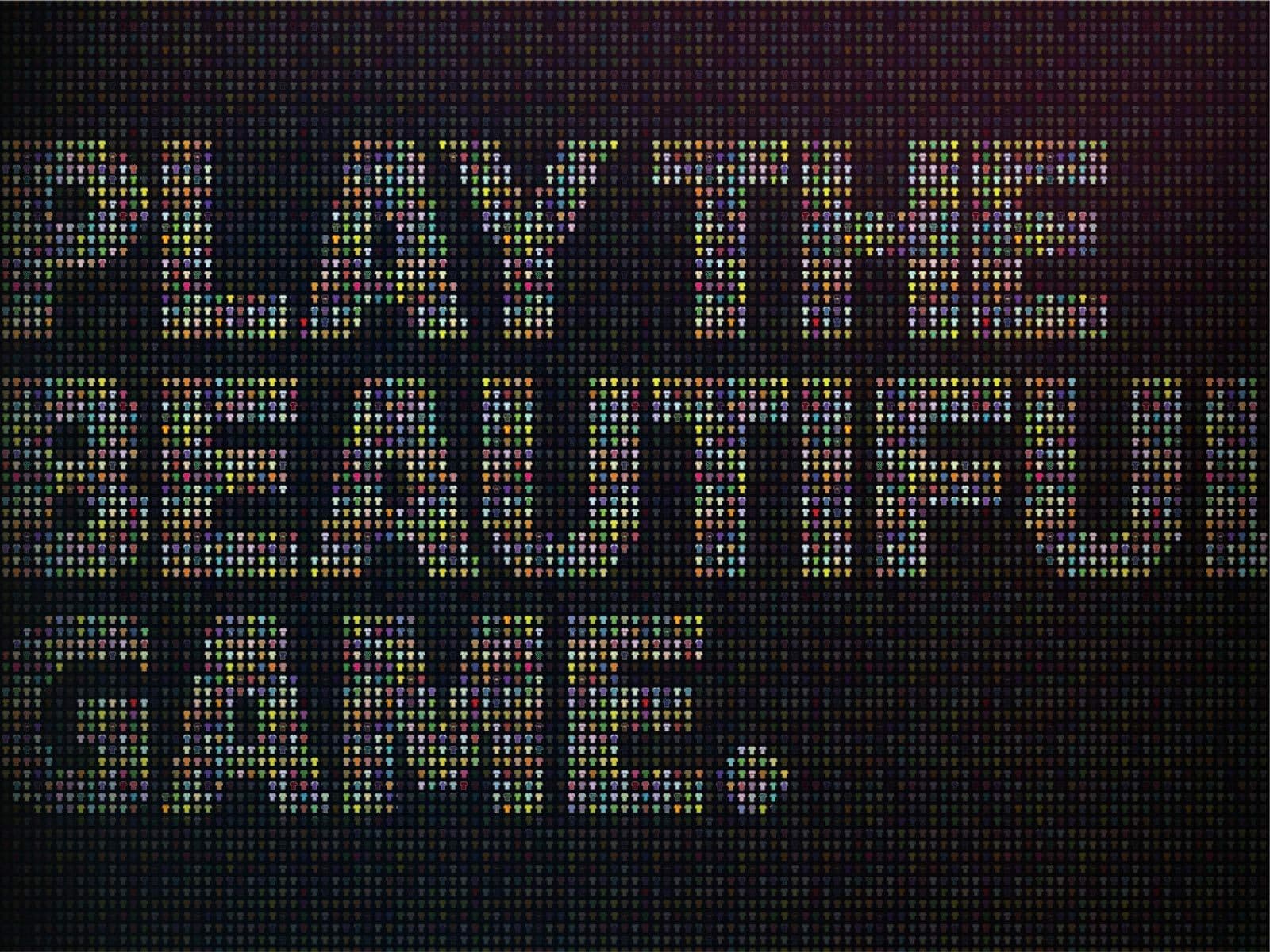 A digital display spells out "Play the Beautiful Game" in pixelated text. The letters are composed of small colored squares, giving a vibrant and mosaic-like appearance. The background is dark, highlighting the colorful text prominently.