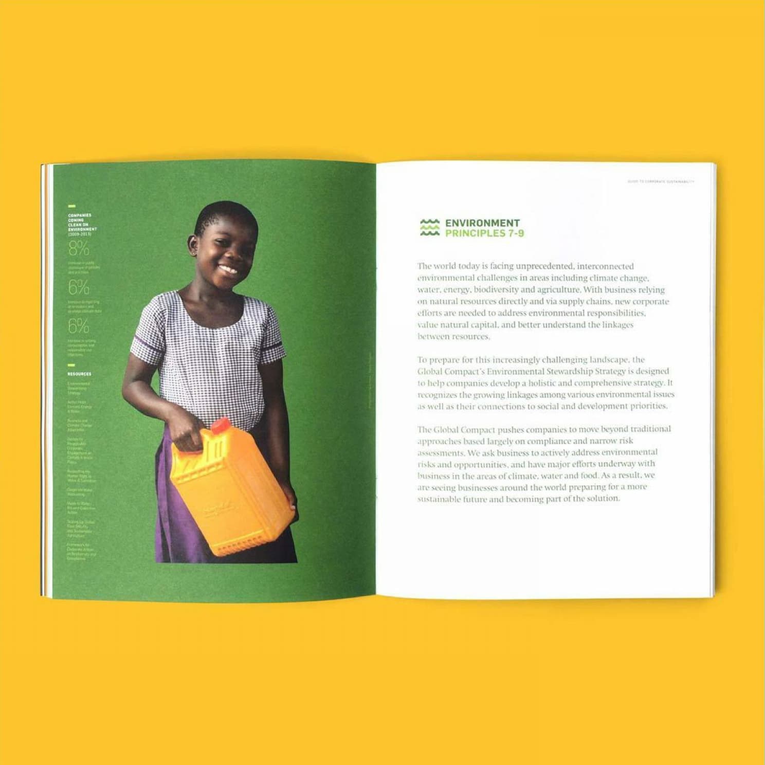 An open magazine on a yellow background. The left page features a young girl in a checkered dress holding a yellow container, standing against a green background. The right page has a title "Environment Principles" followed by paragraphs of text.