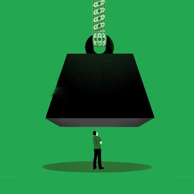 A person stands beneath a large, suspended weight, symbolizing financial stress. The weight hangs from a chain made of dollar bills against a solid green background. The individual appears small and contemplative compared to the looming weight above.
