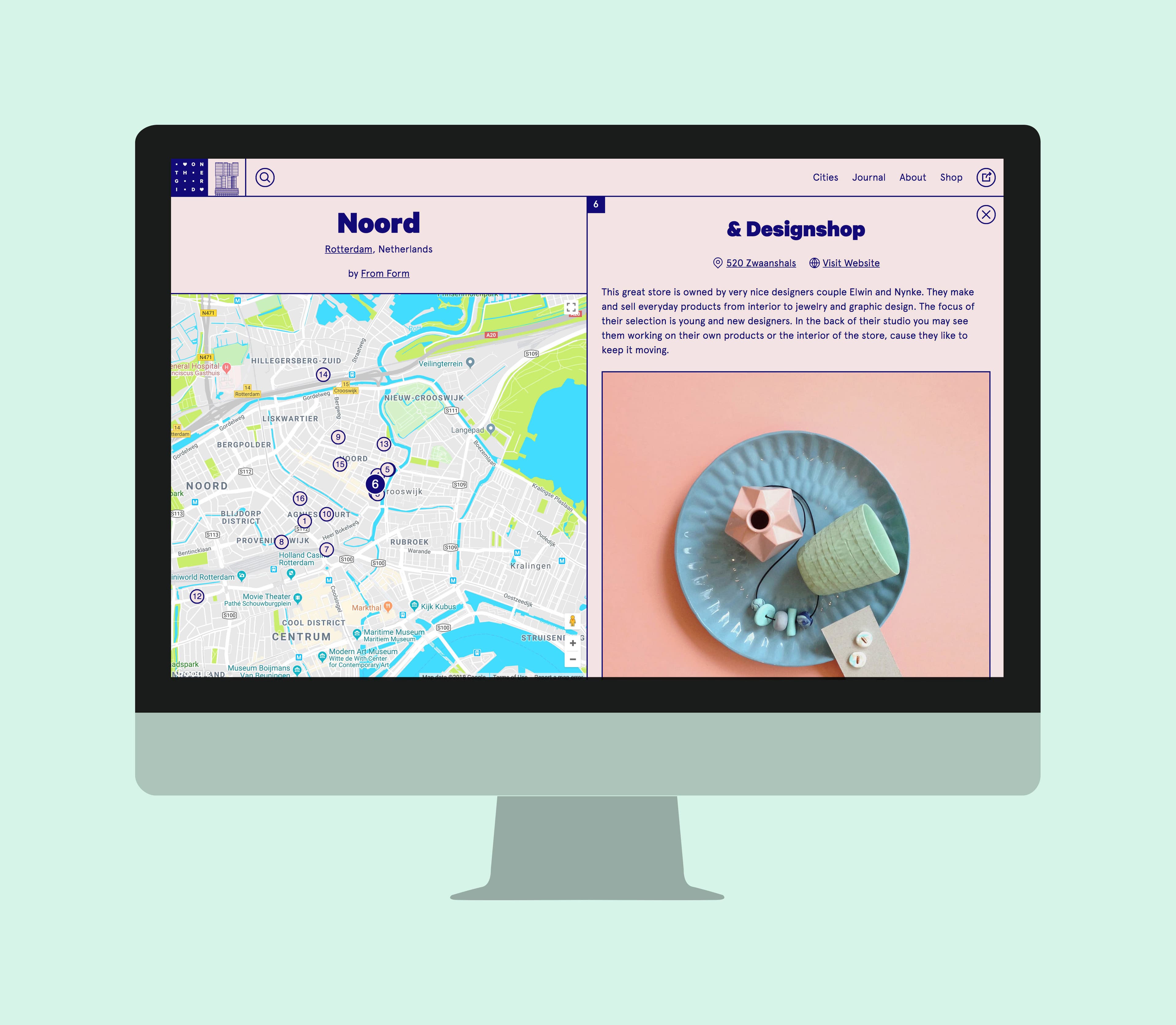 A computer monitor displays a screen with two main sections: the left side shows a map of Rotterdam, Netherlands, with markers and location details; the right side features a description and image of a design shop called "& Designshop," showcasing various design items.