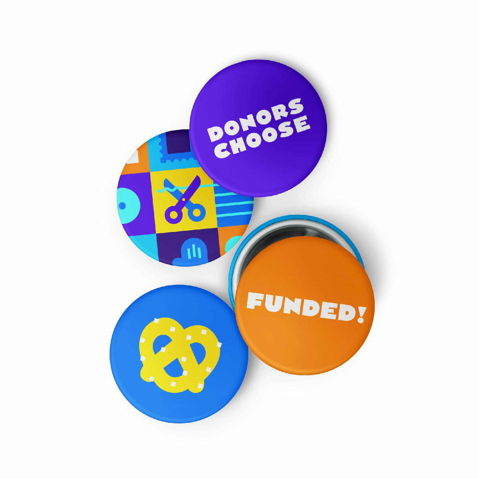 Four colorful circular buttons are arranged on a white background. They read "DONORS CHOOSE," "FUNDED!," one has a yellow pretzel, and one features a collage of playful icons including scissors and a musical note.