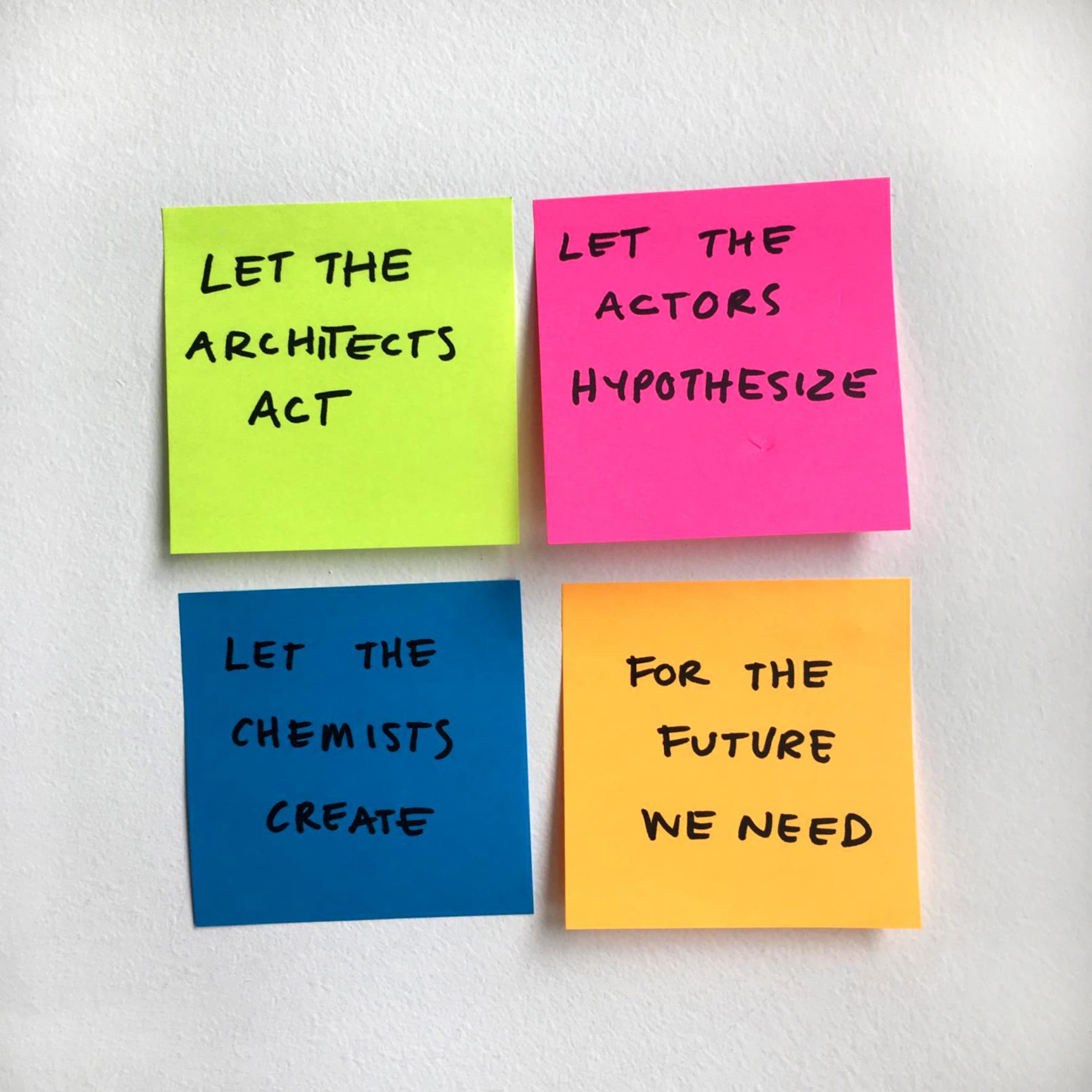 Four sticky notes are arranged on a white surface. The top left green note reads, "Let the architects act." The top right pink note says, "Let the actors hypothesize." The bottom left blue note reads, "Let the chemists create." The bottom right orange note says, "For the future we need.