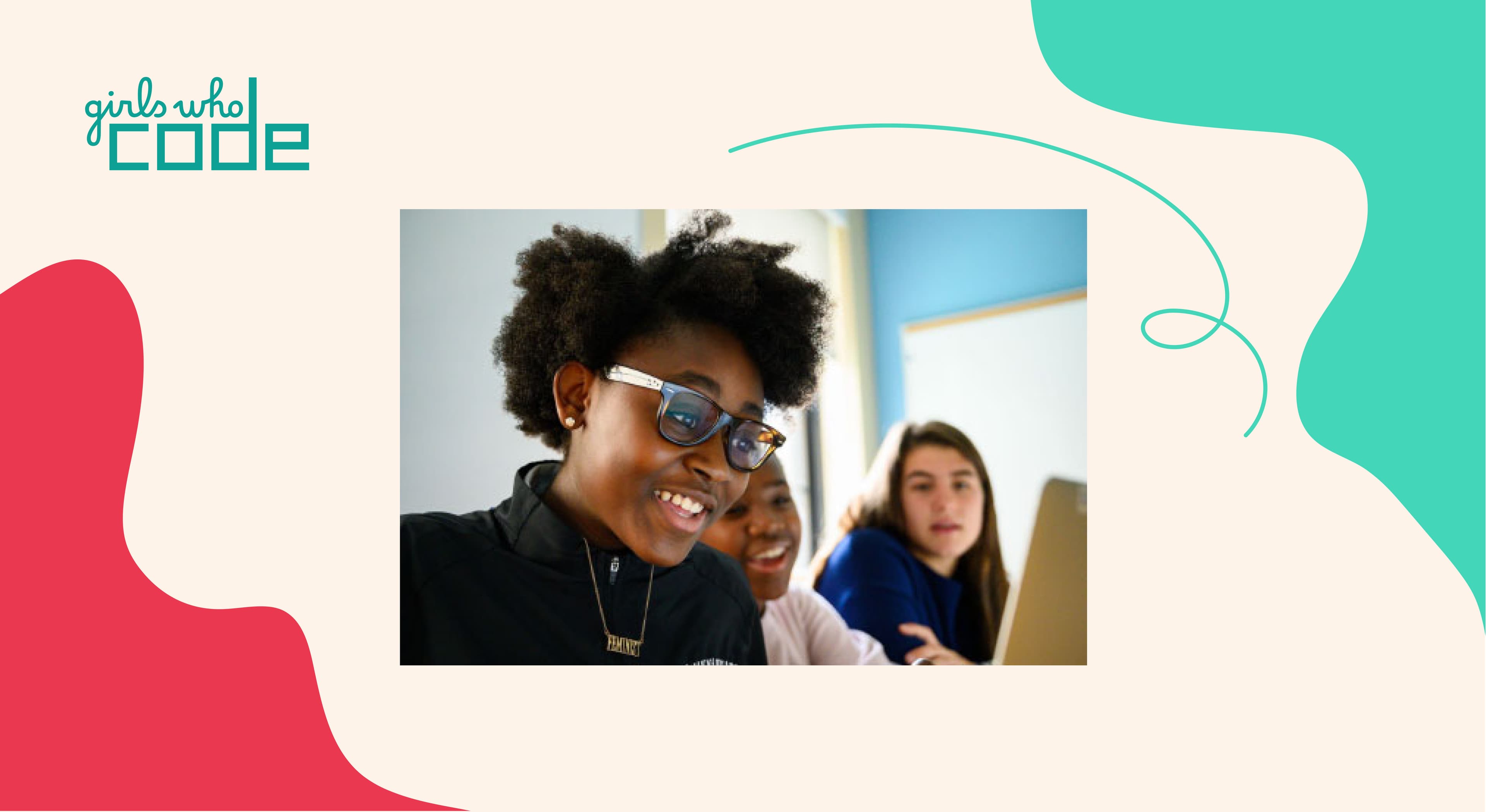 Three girls working together on a laptop, smiling and engaged. The backdrop includes a colorful, abstract design with the "Girls Who Code" logo in the top left corner. The setting appears to be an educational or collaborative environment.