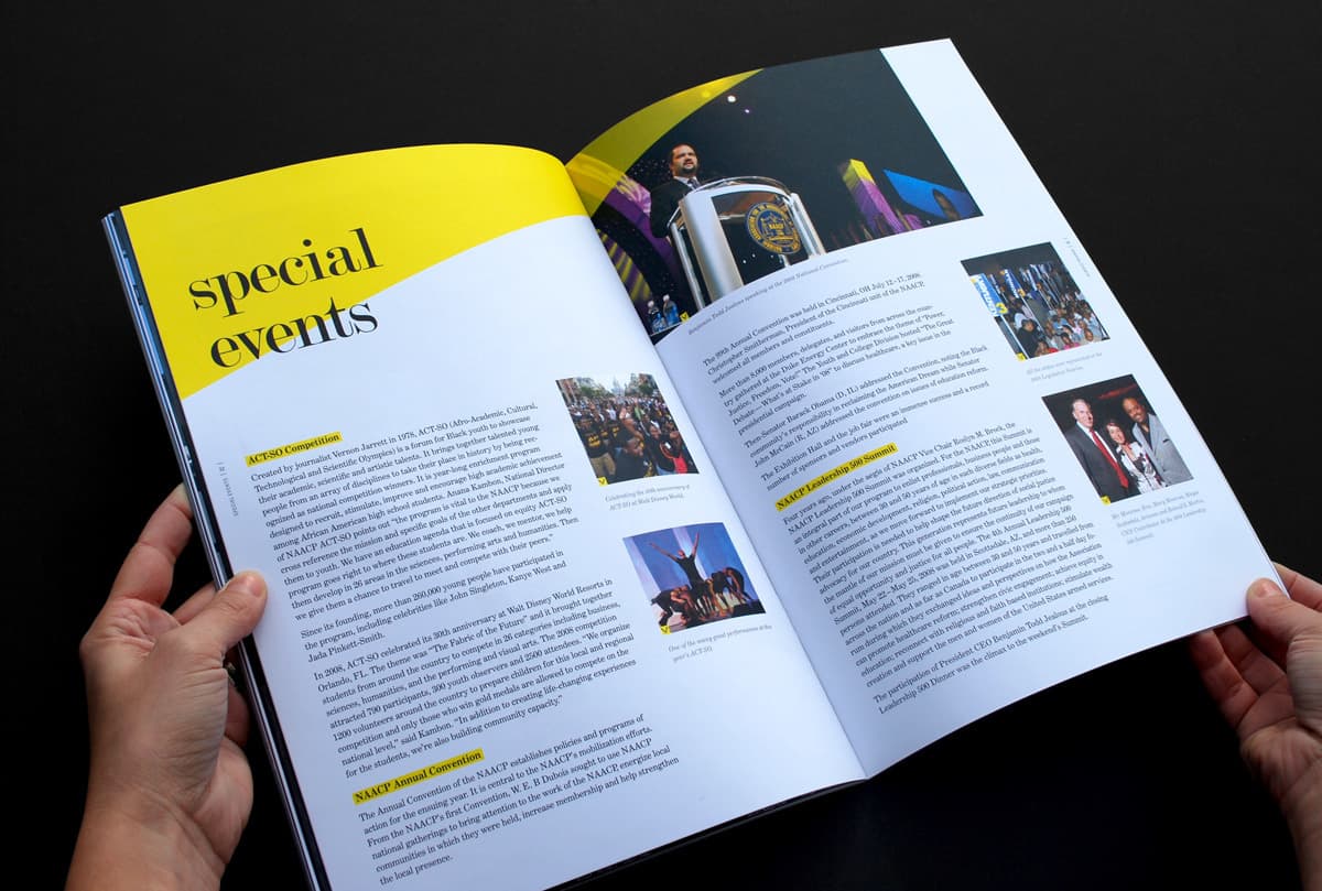 A person holds open a magazine featuring a section titled "Special Events." The pages display an article with multiple paragraphs and several small photographs related to the text. One photo shows a person speaking at a podium, while the others depict various event scenes.