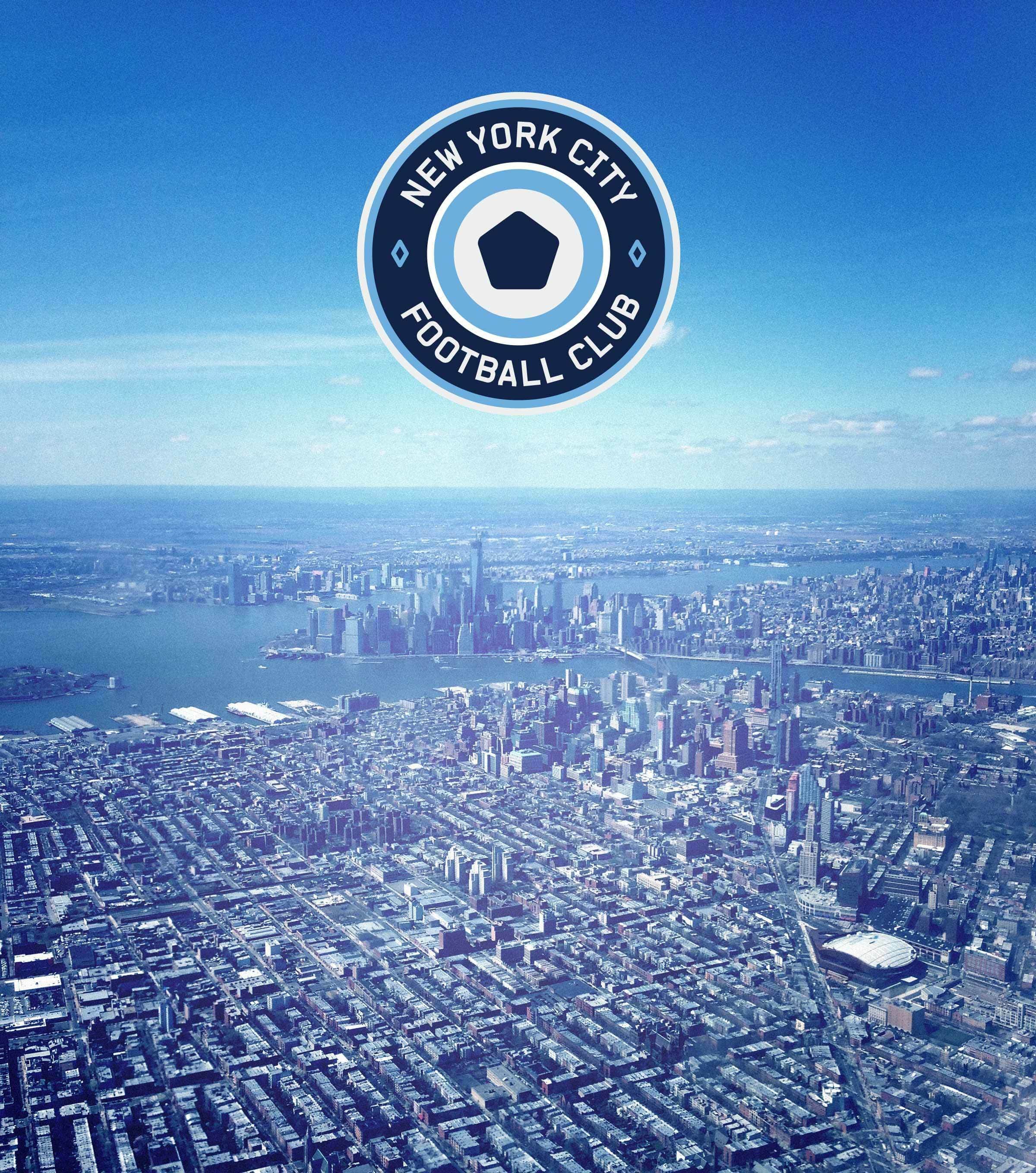 Aerial view of New York City, showing a vast expanse of buildings and skyscrapers with waterways and bridges visible in the distance. The New York City Football Club logo is superimposed at the top center of the image.