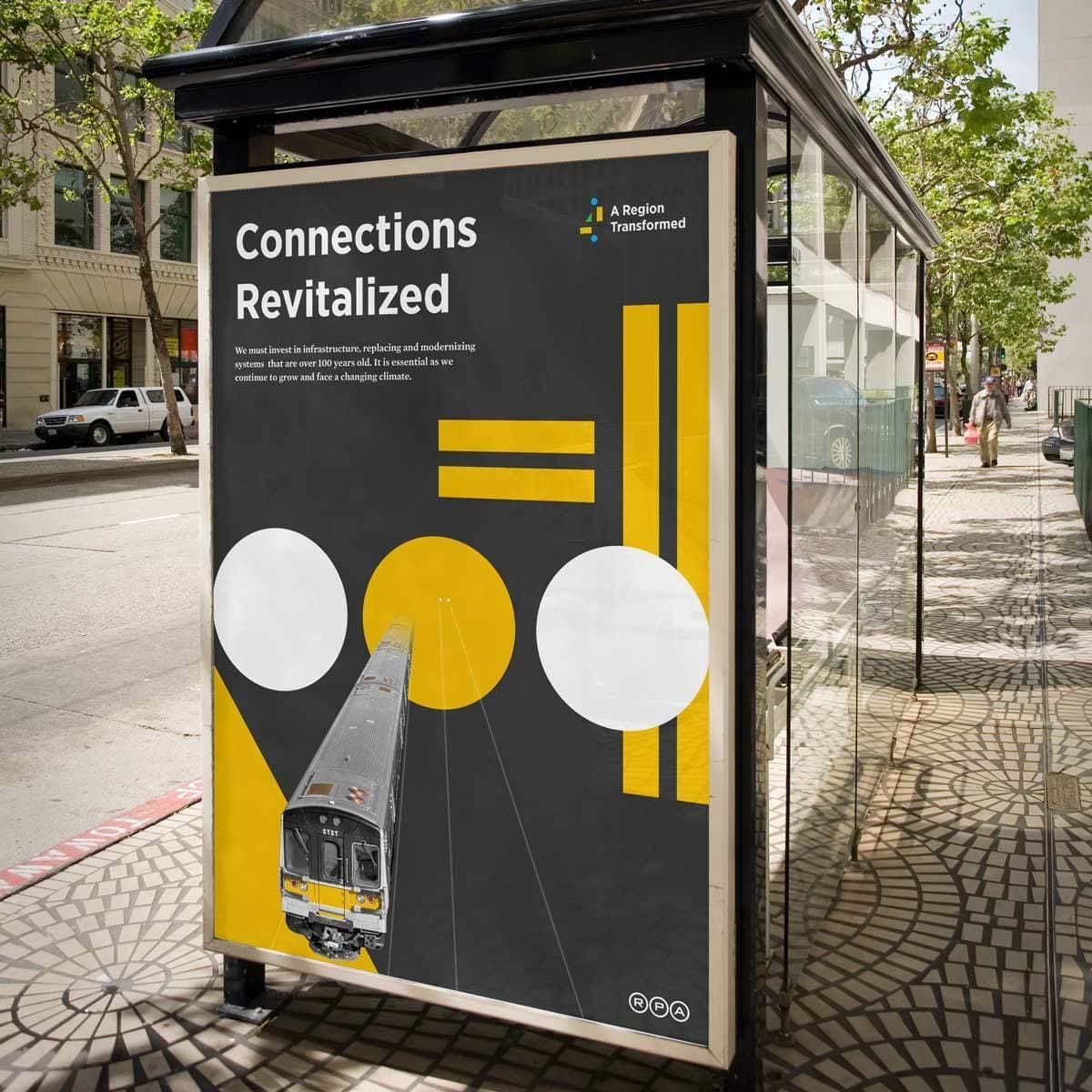 A bus stop shelter features a large poster titled "Connections Revitalized." The poster's abstract design includes geometric shapes and a bus illustration, promoting infrastructure improvements. Trees and buildings line the sunny street in the background.