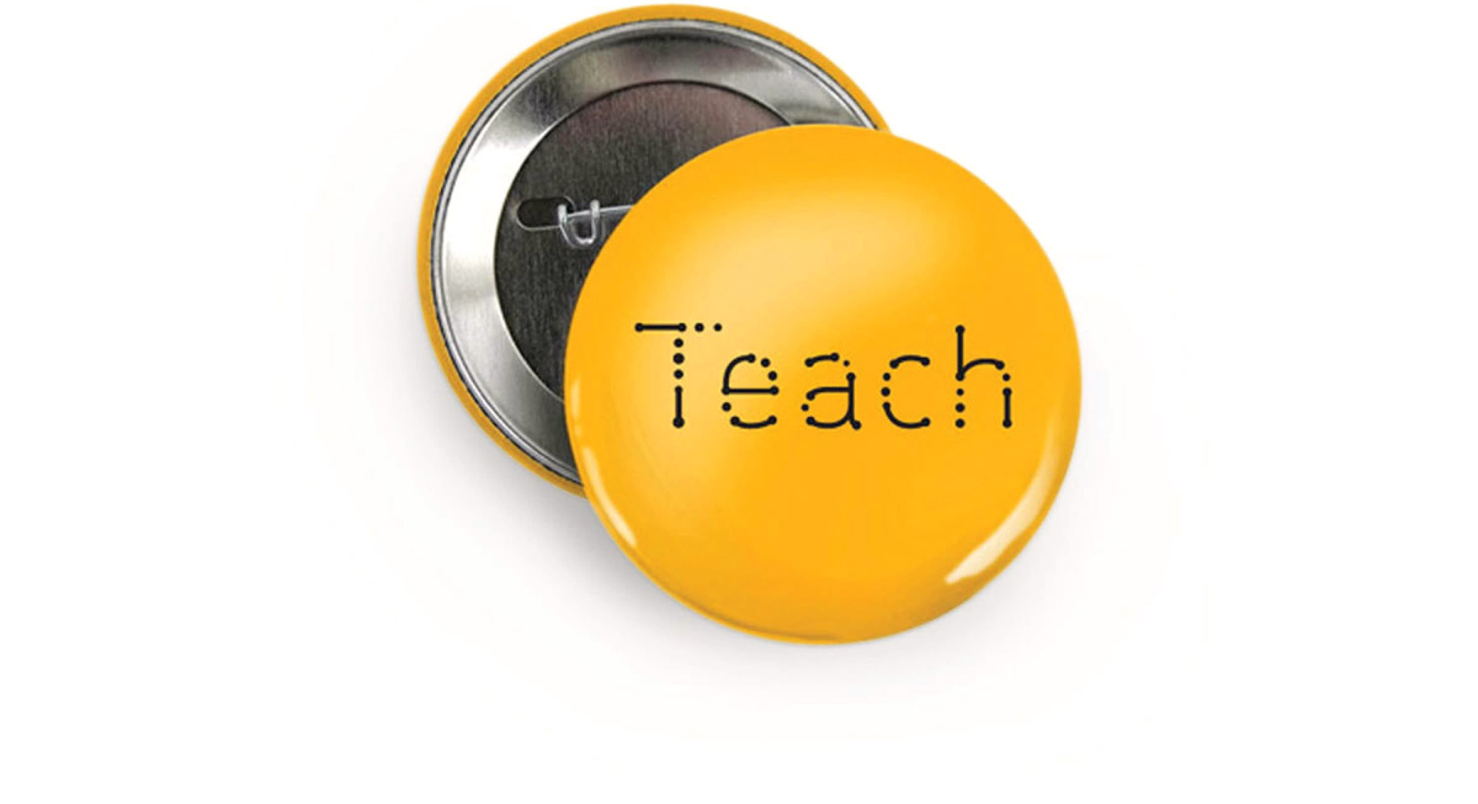 A round yellow button pin with the word "Teach" printed in black, stylized with faint dotted lines forming each letter, is displayed. The pin's back is visible next to it, showing the pin mechanism.